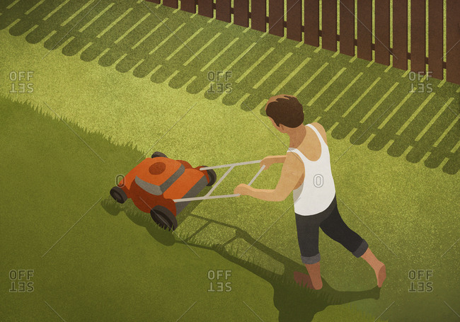 Barefoot man mowing lawn in backyard