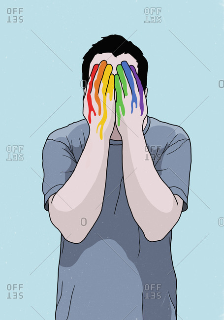Man covering face with rainbow painted hands