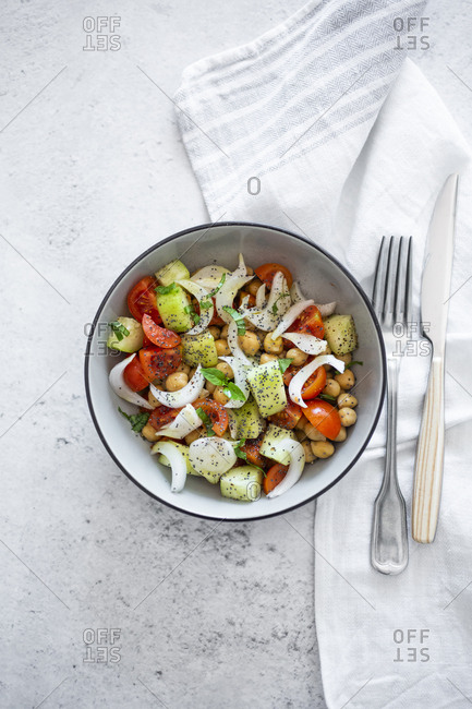 Salad with cucumbers- chickpeas- onion- cherry tomatoes- basil- chia seed