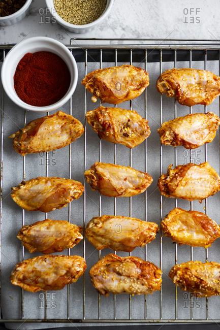 Preparing of spicy chicken wings- grid