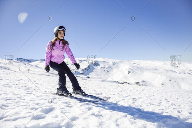 Woman skiing under blue sky- Sierra Nevada- Andalusia- Spain