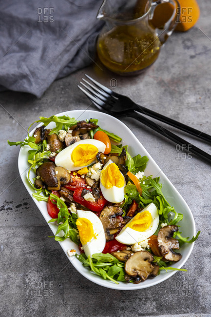 Rocket salad with fried champignons- hard-boiled egg- tomatoes and feta
