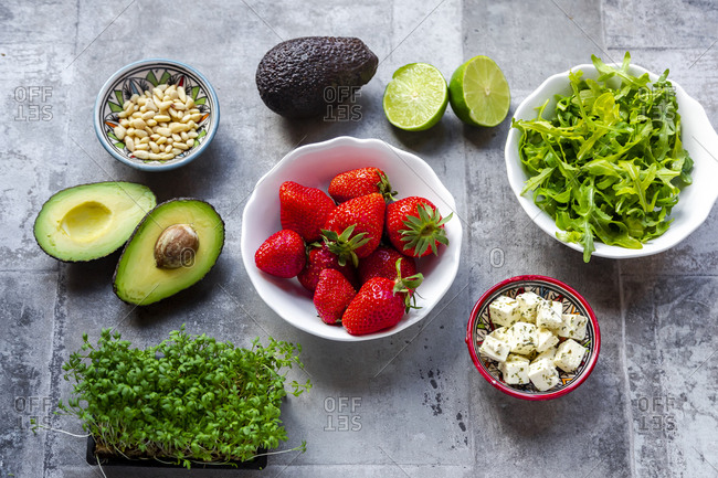 Strawberry avocado salad with feta- rocket- pine nuts and cress
