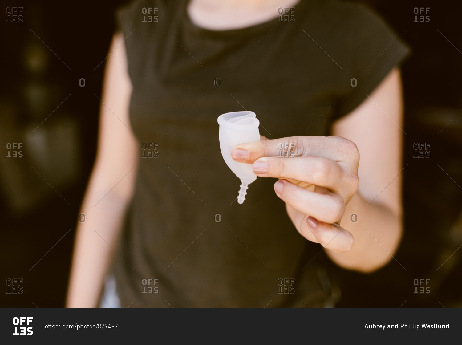 Woman folding a period cup