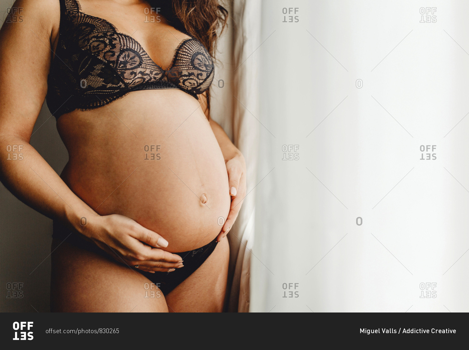 Happy pregnant female in underwear stock photo pic