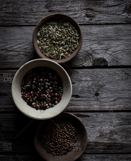 Top view of mixed dry spices on wooden table board