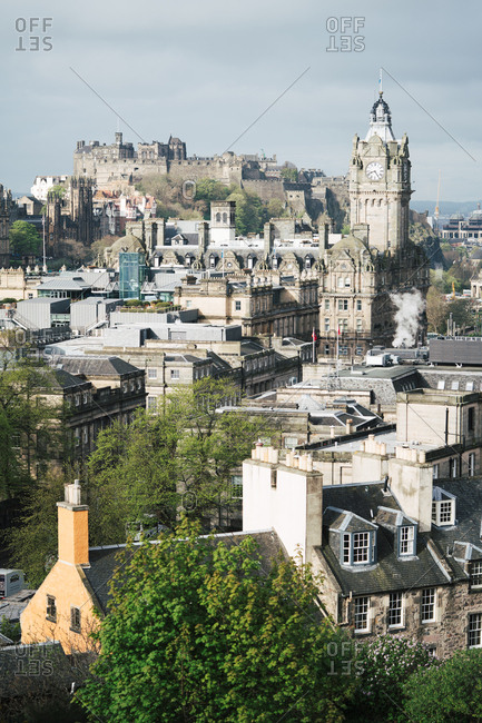 June 25, 2019: Panoramic view of old town with Gothic buildings against clouds in sunlight, Scotland