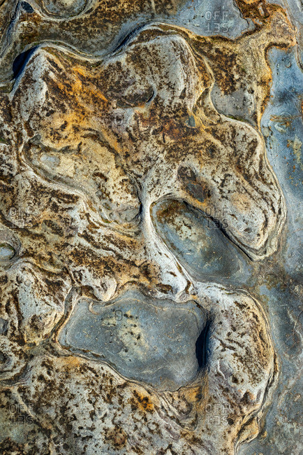 View of tide pool rocks with unique colors and patterns from above