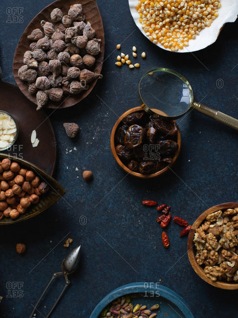 Flat lay with nuts and dried fruits: hazelnuts, walnuts, raisins