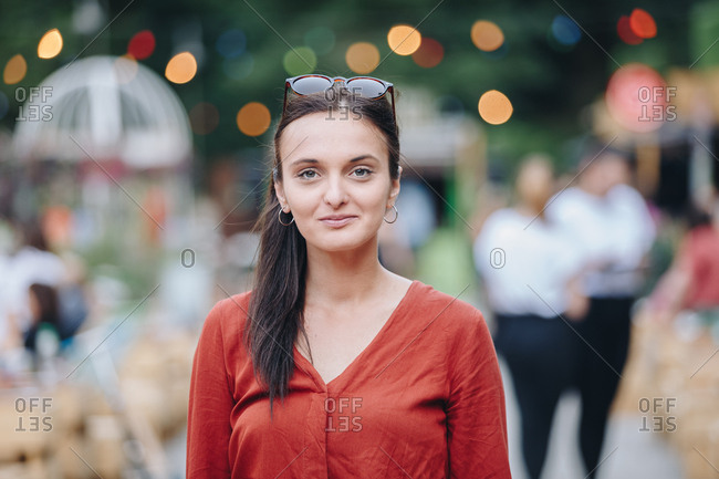 Authentic portrait of an attractive young brunette woman attending a summer music festival