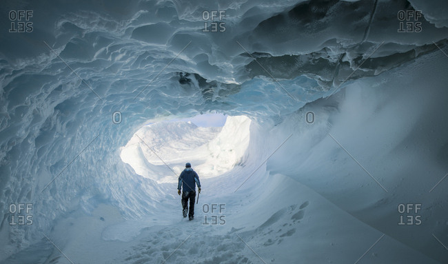 A tunnel through an iceberg stuck in the frozen surface of the McMurdo Sound in the Ross Sea Region of Antarctica.