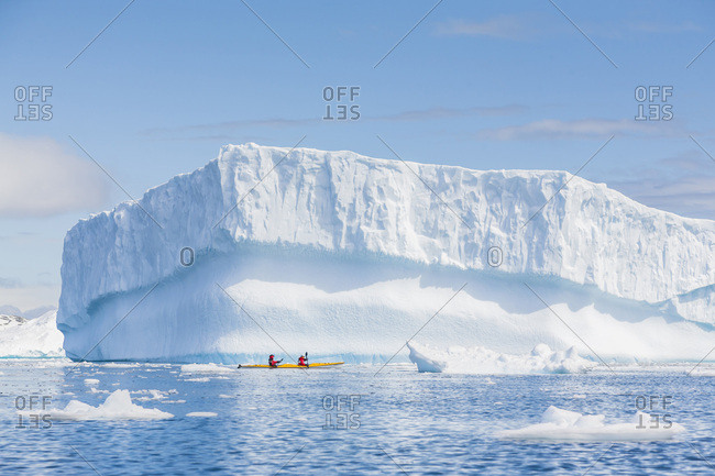 Paddlers in a double sea kayak, Cierva Cove, Antarctic Peninsula, Antarctica.