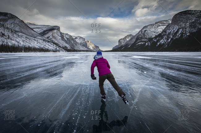 Ice skating at Lake Minnewanka, Banff National Park, Alberta, Canada