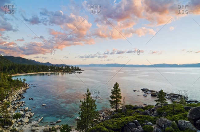 Beautiful clouds are illuminated at sunset over Sand Harbor and Lake Tahoe, Nevada.