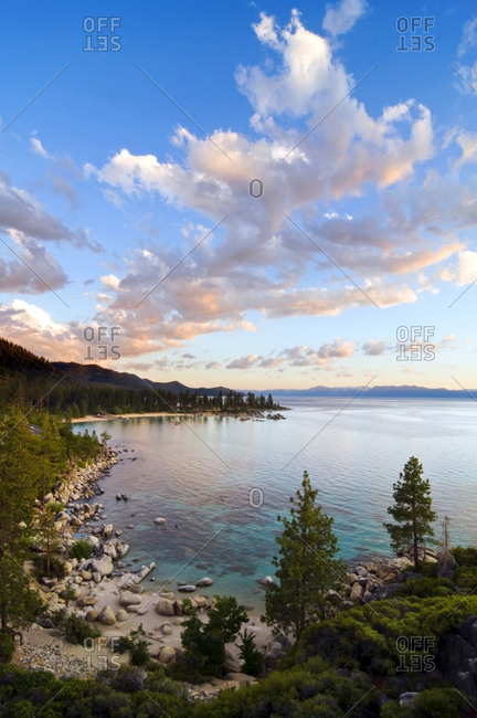 Beautiful clouds are illuminated at sunset over Sand Harbor and Lake Tahoe, Nevada.