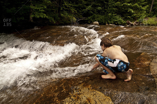 Testing the waters before jumping into the cold mountain stream.