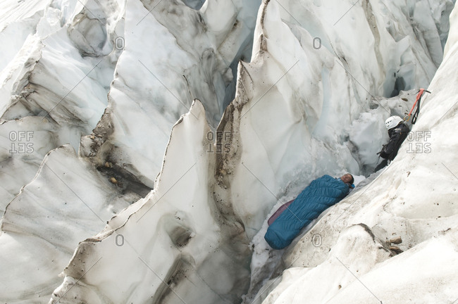 A woman sleeping in an icy crevasse, Mount Baker Wilderness, Bellingham, Washington.