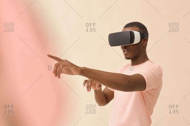 Portrait of young man wrapped up in virtual reality