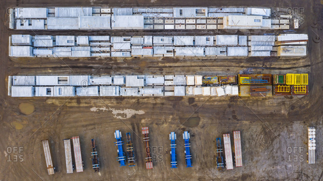 Aerial view of finished concrete slabs and related products at a concrete manufacturing facility in the afternoon sun in Aurora, IL, USA