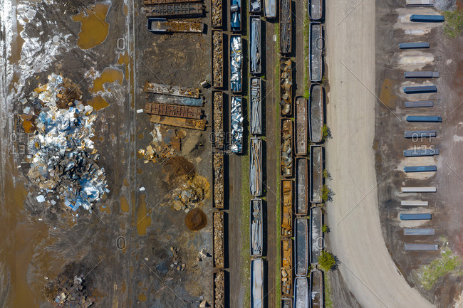 Aerial view of rail road cars, scrap metals and finished steel products at a modern steel producing facility on the shores of Lake Michigan in Indiana.