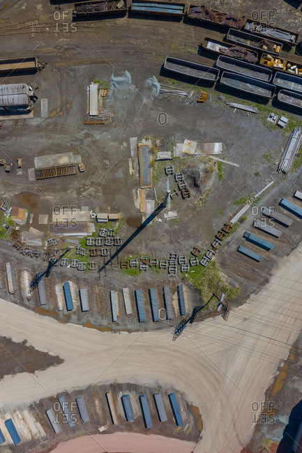 Aerial view of scrap metals and finished flat rolled steel products at a modern steel producing facility on the shores of Lake Michigan in Indiana.