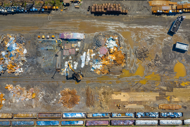 Aerial view of rail road cars, scrap metals and finished steel products at a modern steel producing facility on the shores of Lake Michigan in Indiana.