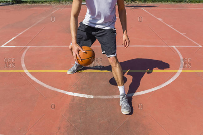 Young man playing basketball