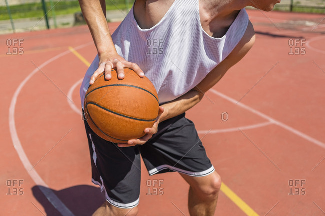 Young man playing basketball