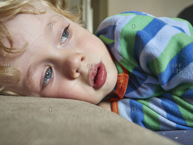 Portrait of lying little boy