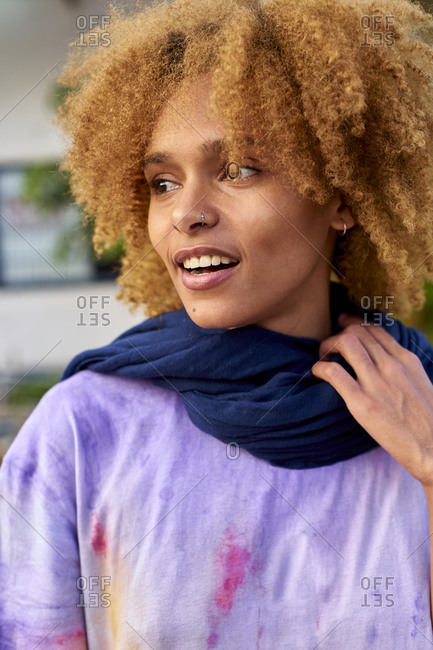 Portrait of smiling woman with curly hair