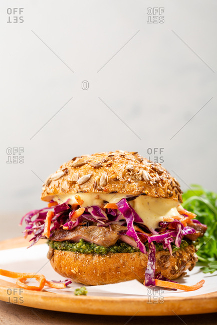 Sliced meat sandwich with fresh slaw and salad