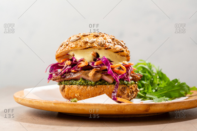 Sliced steak burger and cole slaw on plate
