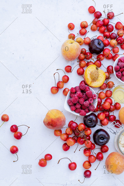 Variety of fresh fruits and berries: cherries, raspberry, peaches