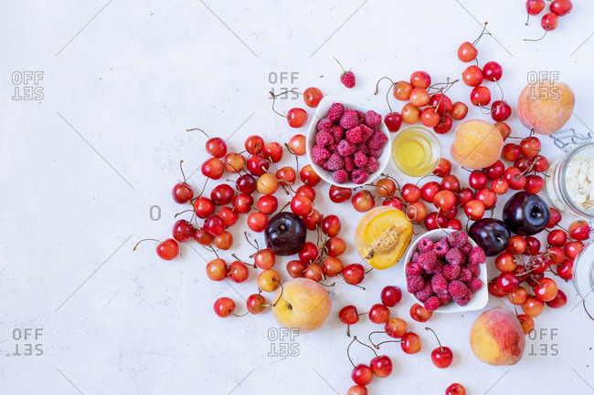 Variety of fresh fruits and berries and copy space