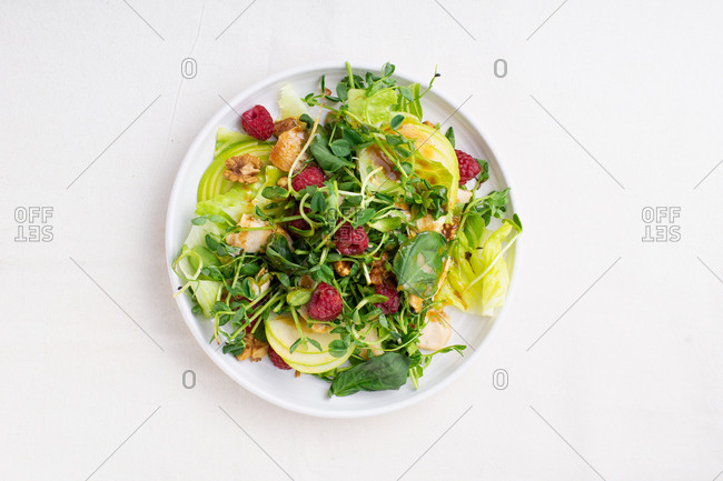 Prosciutto, apple and raspberry salad with peanut dressing