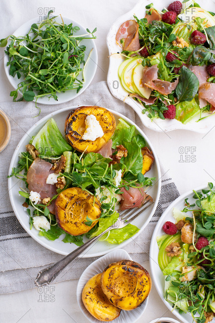 High angle view of a variety of summer salads and dressings
