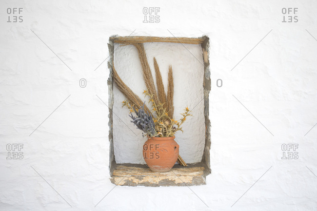 Old style vase decoration in cafe wall, Folegandros Island, Cyclades, Greece
