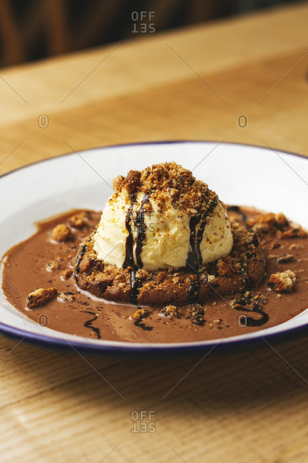Tasty sweet burger with chocolate crumb and nuts