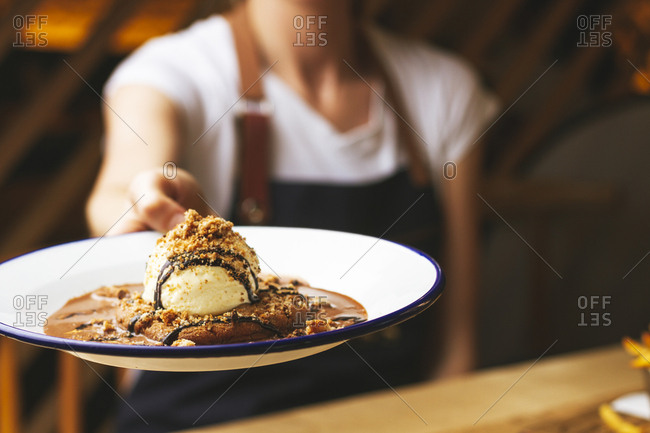 Tasty sweet burger with chocolate crumb and nuts