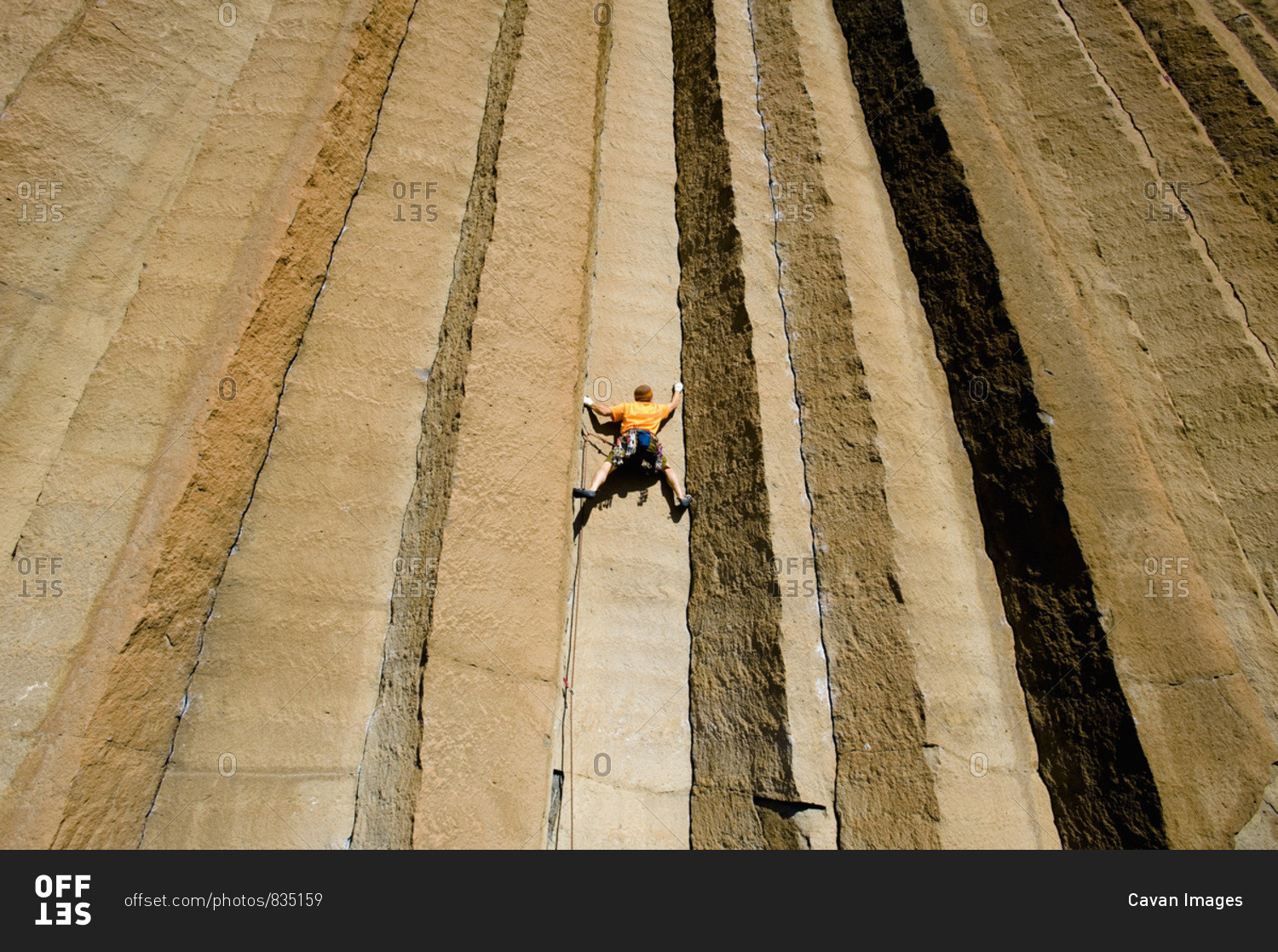 A mid adult man rock climbing at Trout Creek, Oregon.