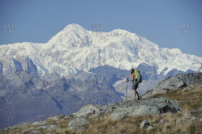 Backpacker hikes Kesugi Ridge Trail in Denali State Park, Alaska.