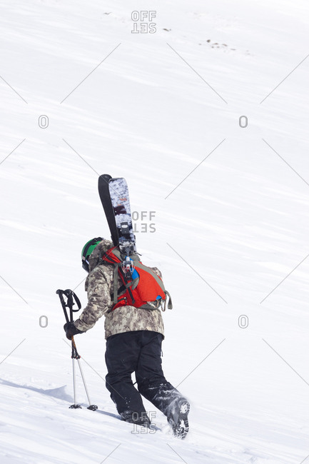A male skier hikes to his ski line at Big Sky Resort in Big Sky, Montana.