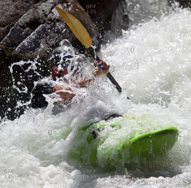 Man kayaks in whitewater rapids on Wilson Creek, NC.