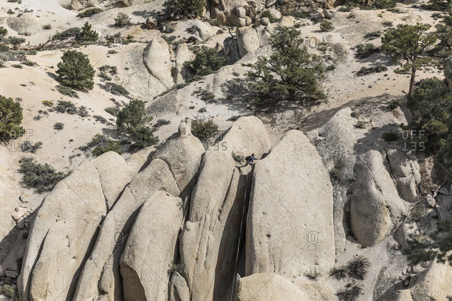 Climber on top of the boulder in Bishop, California