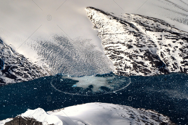 Aerial view of a glacier in the Kujalleq Municipality of Greenland. These glaciers are receding due to climate change.