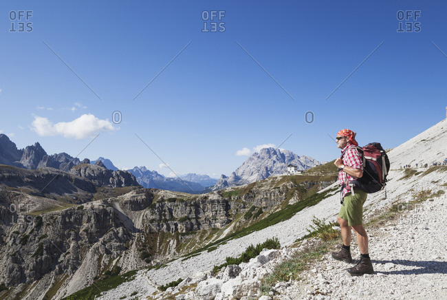 Hiker on hiking trail- Tre Cime di Lavaredo Aera- Nature Park Tre Cime- Unesco World Heritage Natural Site- Sexten Dolomites- Italy