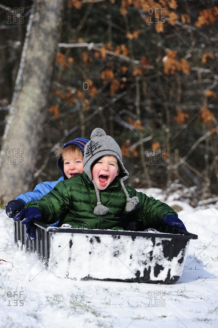 Two Boys Playing In The Snow