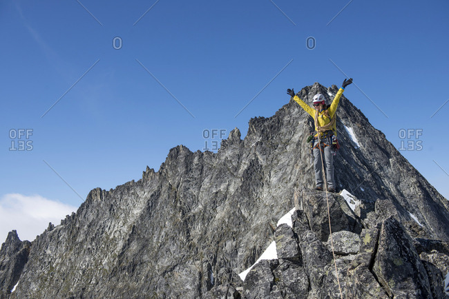 Woman climbing on the North Ridge of Forbidden Peak in North Cascades National Park.