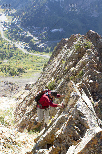 A man enjoying a fall hike on the South Ridge of Mt Superior, Utah