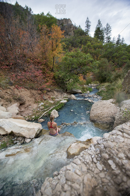 A woman enjoying a nice fall soak at the Diamond Fork Hot Springs, Utah